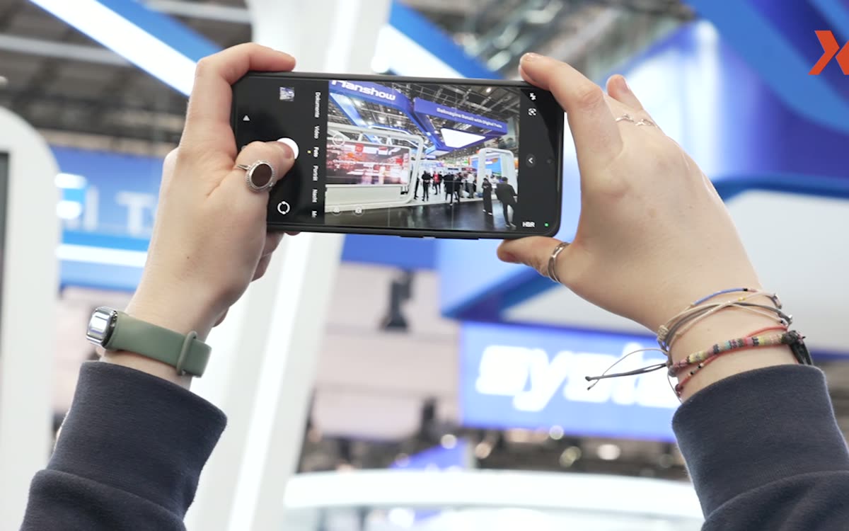 Smartphone filming a trade show presentation